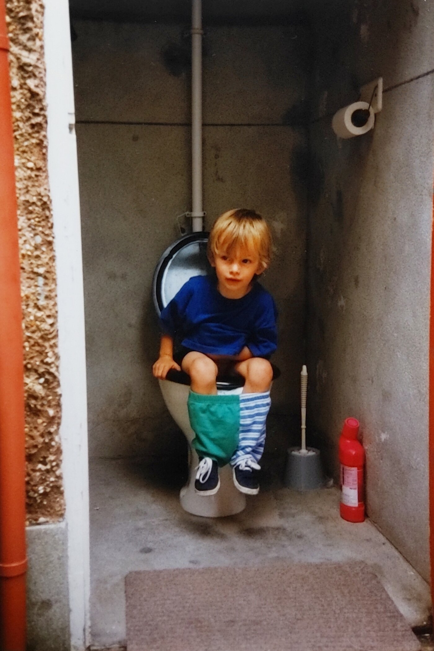Giz Edwards sat on a toilet as a child
